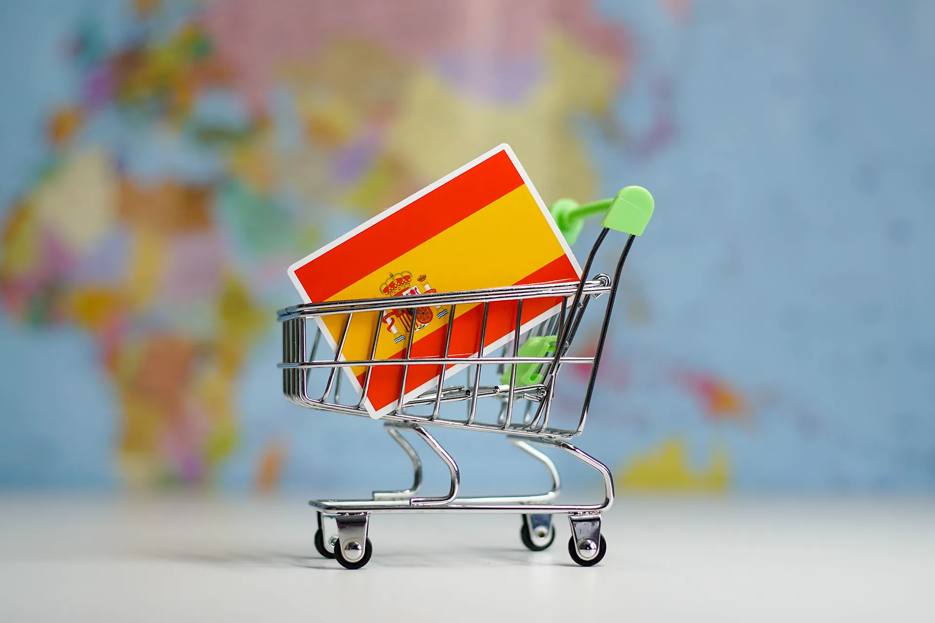 spain-national-flag-in-miniature-shopping-trolley-2022-09-28-22-52-45-utc